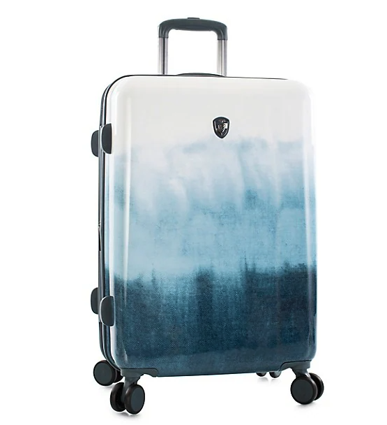 Heys Tie-Dye Blue 26-Inch Fashion Spinner Medium Suitcase. Image via The Bay.