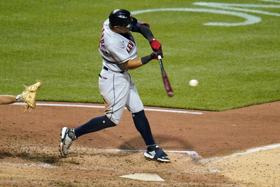 Cleveland Indians' Cesar Hernandez hits a grand slam off Pittsburgh Pirates relief pitcher Sam Howard during the seventh inning of a baseball game in Pittsburgh, Friday, June 18, 2021. (AP Photo/Gene J. Puskar)