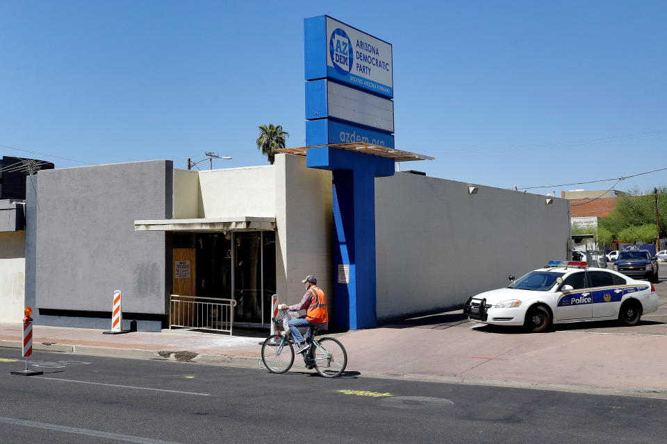 Phoenix Police block the entrance outside the Arizona Democratic Party headquarters Friday, July 24, 2020, in Phoenix. Fire investigators are looking into the cause of an early morning blaze that destroyed part of the Arizona and Maricopa County Democratic Party headquarters Friday. (AP Photo/Matt York)