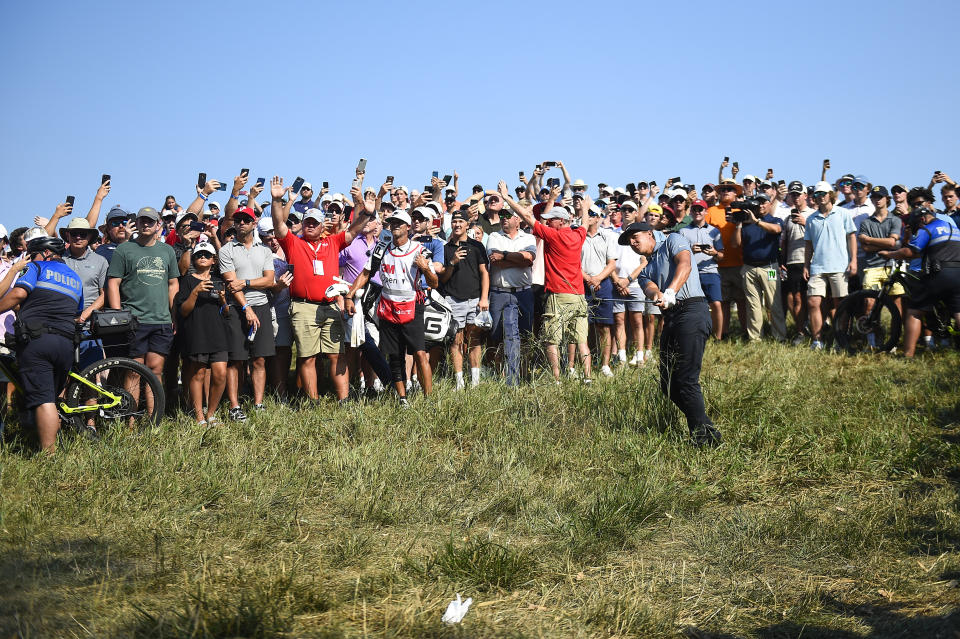 Cameron Champ hits a shot out of the rough on the 18th hole of the 3M Open golf tournament in Blaine, Minn., Sunday, July 25, 2021. (AP Photo/Craig Lassig)