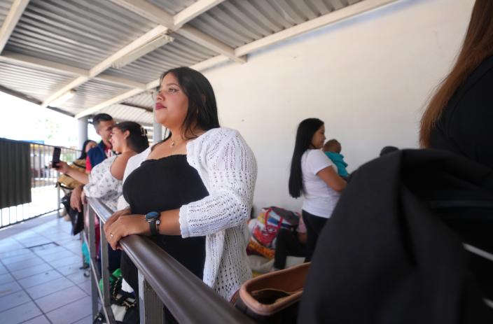 Daileska Giovanna Vaquero Escalona waits in line in Nogales, Sonora, where she has a CBP One appointment with U.S. Customs and Border Protection.