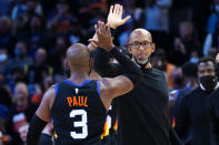 Phoenix Suns guard Chris Paul (3) high fives head coach Monty Williams during the second half of an NBA basketball game against the Golden State Warriors, Tuesday, Nov. 30, 2021, in Phoenix. The Suns won 104-96. (AP Photo/Matt York)