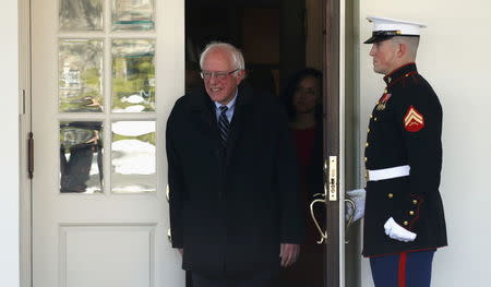 U.S. Democratic presidential candidate Bernie Sanders walks from the West Wing of the White House to speak to reporters after his meeting with U.S. President Barack Obama in Washington January 27, 2016. REUTERS/Kevin Lamarque