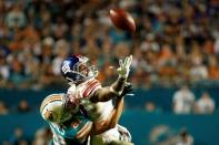 Dec 14, 2015; Miami Gardens, FL, USA; New York Giants wide receiver Odell Beckham Jr. (13) is unable to make a catch as Miami Dolphins cornerback Brent Grimes (21) defends during the second half at Sun Life Stadium. Mandatory Credit: Steve Mitchell-USA TODAY Sports