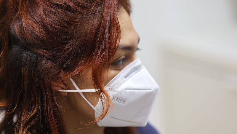 Angie Gonzales waits to receive her COVID-19 vaccine at Salt Lake County Health Center in Salt Lake City on Wednesday, Oct. 4, 2023.