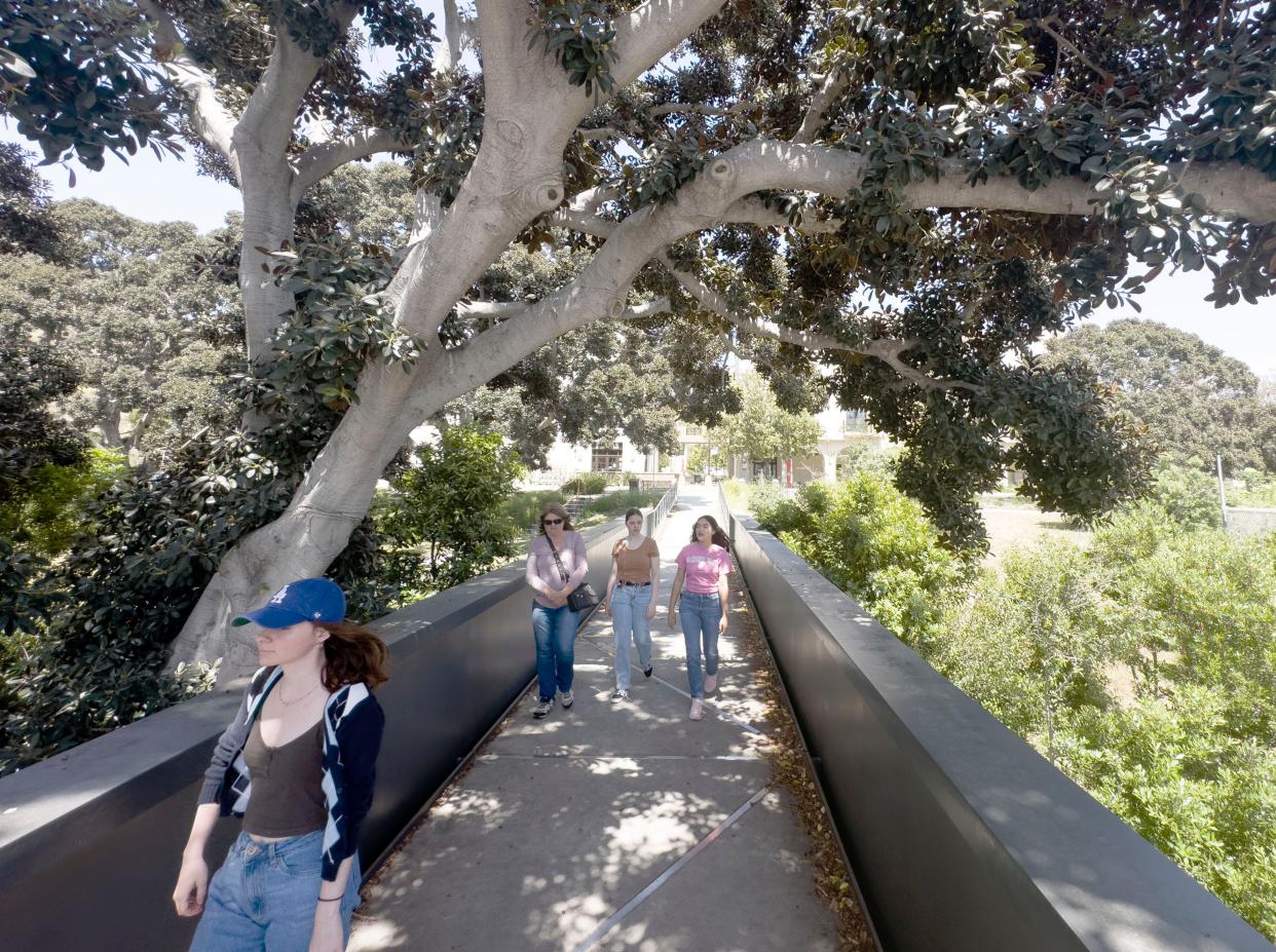 Camarillo resident Jessica Collins, 21, from left, Thousand Oaks residents Janice Wilson and her daughter Emma Wilson, 19, accompany Liz Hernandez, student ambassador at CSU Channel Islands, on a campus tour In June.