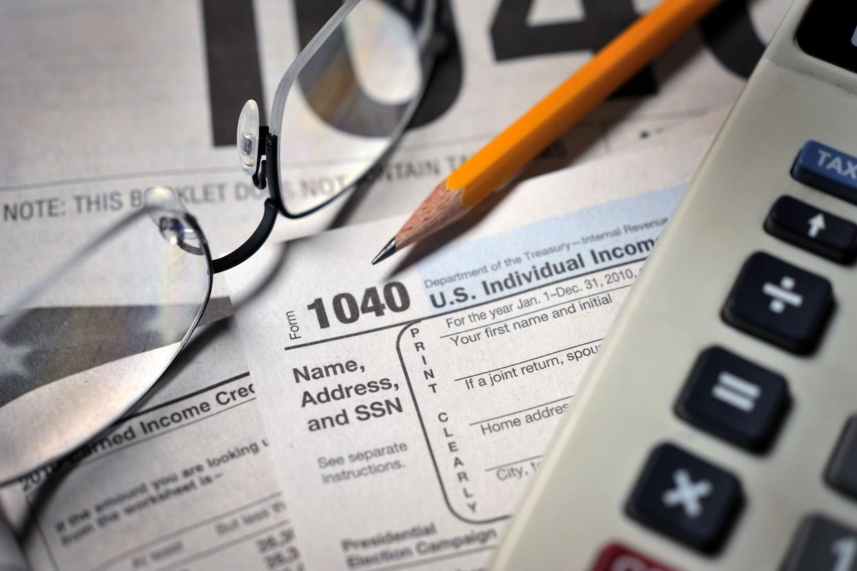 filing taxes on IRS Form 1040 close-up view