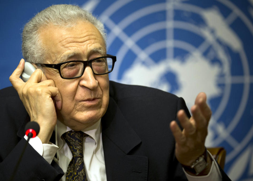 U.N. mediator Lakhdar Brahimi, left, gestures during a press briefing at the United Nations headquarters in Geneva, Switzerland, Switzerland, Tuesday, Feb 11, 2014. A second round of peace talks between the Syrian government and the opposition bogged down quickly Tuesday in recriminations about who was responsible for escalating violence that has killed hundreds in the past few days and disrupted food aid for trapped civilians. (AP Photo/Anja Niedringhaus)