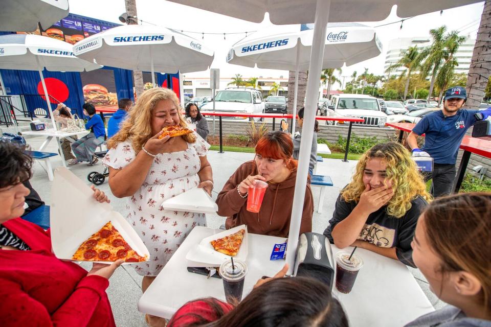 A group of women eating at the Skechers Food Spot.