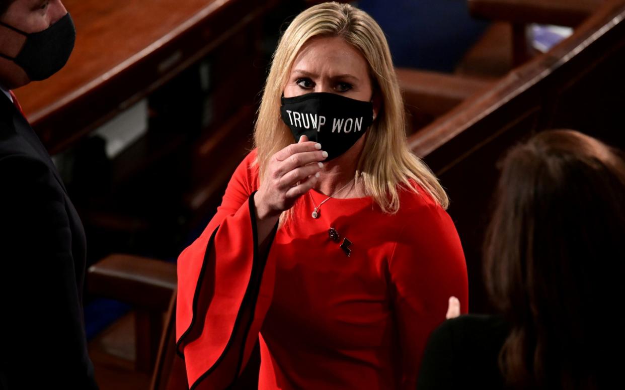 Rep. Marjorie Taylor Greene (R-GA) wears a "Trump Won" face mask as she arrives to take her oath of office as a member of the 117th Congress in Washington - Reuters