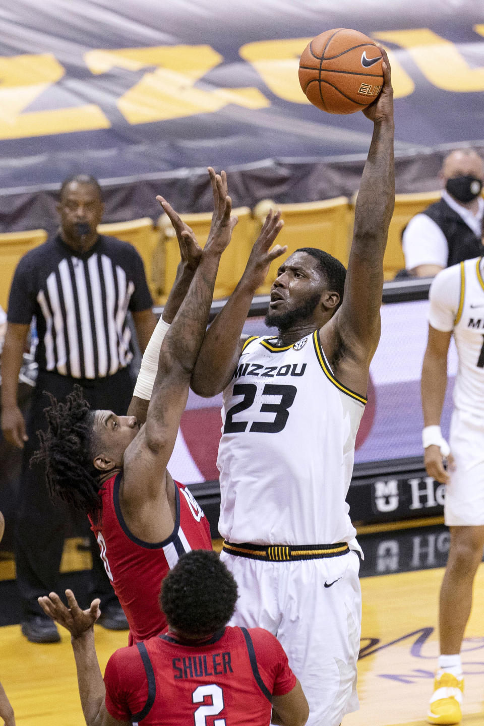 Missouri's Jeremiah Tilmon, right, shoots over Mississippi's Romello White, top left, during the second half of an NCAA college basketball game Tuesday, Feb. 23, 2021, in Columbia, Mo. (AP Photo/L.G. Patterson)