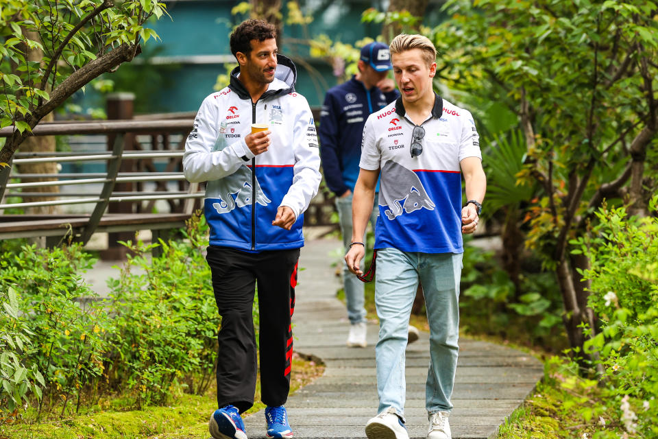 SHANGHAI, CHINA - APRIL 20: Daniel Ricciardo of Australia and Visa Cash App RB and Liam Lawson of New Zealand and Visa Cash App RB talk in the paddock during the Sprint ahead of the F1 Grand Prix of China at Shanghai International Circuit on April 20, 2024 in Shanghai, China. (Photo by Kym Illman/Getty Images)