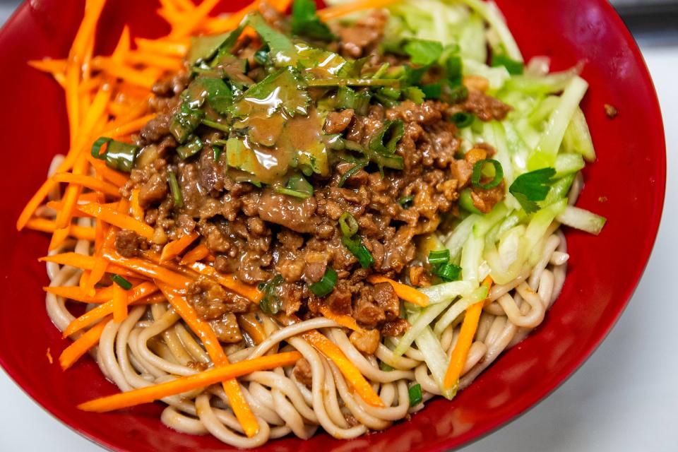 A dish waits to be picked up during lunch service at Beijing Noodle in Fort Collins, Colo., on Tuesday, Dec. 19, 2023. Beijing Noodle has been chosen for USA Today's best restaurants of the year list.