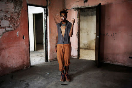 Teflon, 19, who is among members of lesbian, gay, bisexual and transgender (LGBT) community, that have been invited to live in a building that the roofless movement has occupied, poses for a portrait, in downtown Sao Paulo, Brazil, November 26, 2016. REUTERS/Nacho Doce