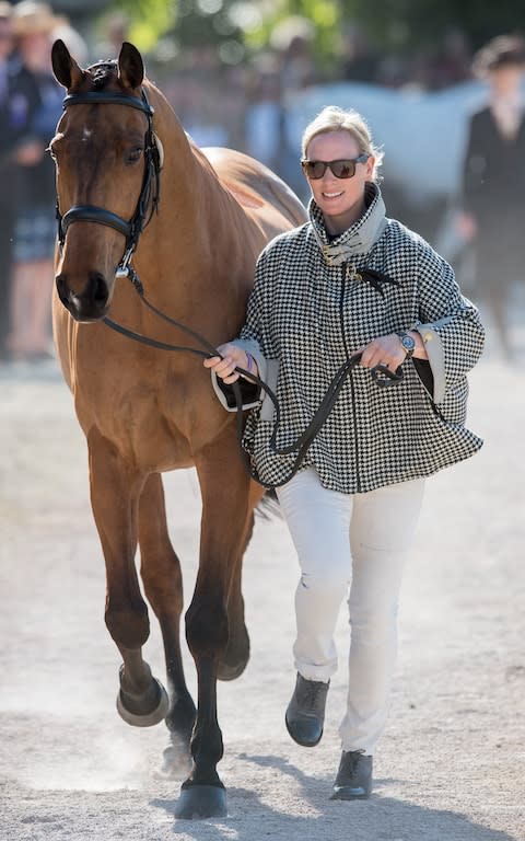 Zara Tindall at the trot-up wearing a Holland Cooper cape - Credit: Rex