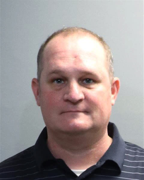 FILE - This booking photo provided by the Oakland County Sheriff's Office shows Eric Wuestenberg. On Monday, March 13, 2023, criminal charges were dropped against Jillian and Eric Wuestenberg, a white couple charged in 2020 after one of them was captured on video pulling a handgun on a Black woman and her daughters outside a Michigan restaurant. (Oakland County Sheriff's Office via AP, File)