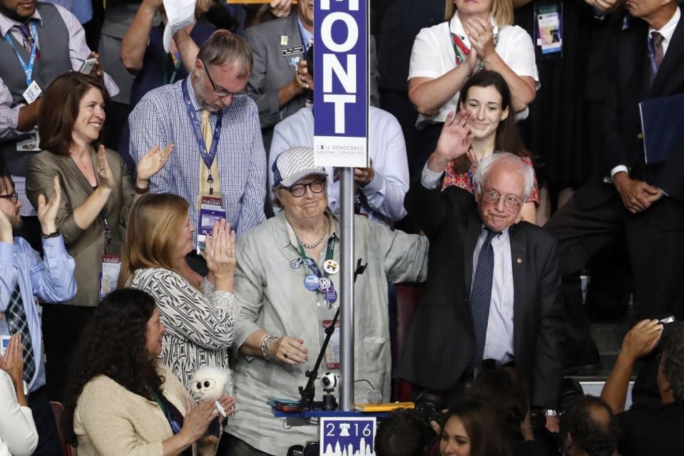 Standing with the Vermont delegation, Bernie Sanders waves after asking the convention to make Clinton the unanimous choice for president of the United States. (Photo: Mary Altaffer/AP)