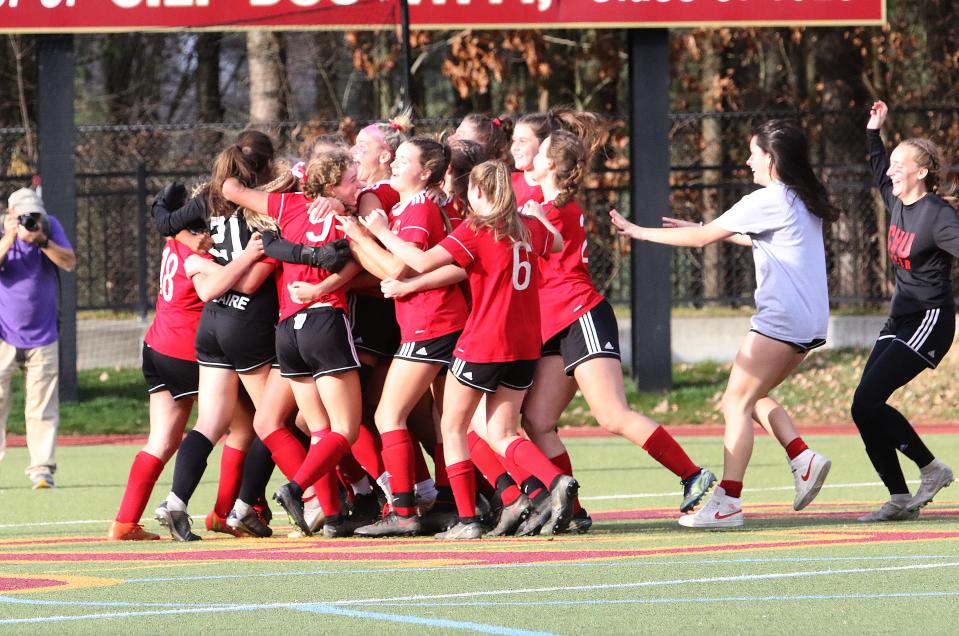 The Redhawks celebrate after the final whistle of their 1-0 win over MMU in the D1 Championship game on Sunday afternoon at Norwich University.
