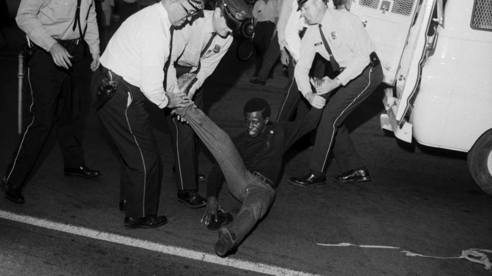 An open housing protester is dragged to a paddy wagon by Louisville police on May 26, 1967.