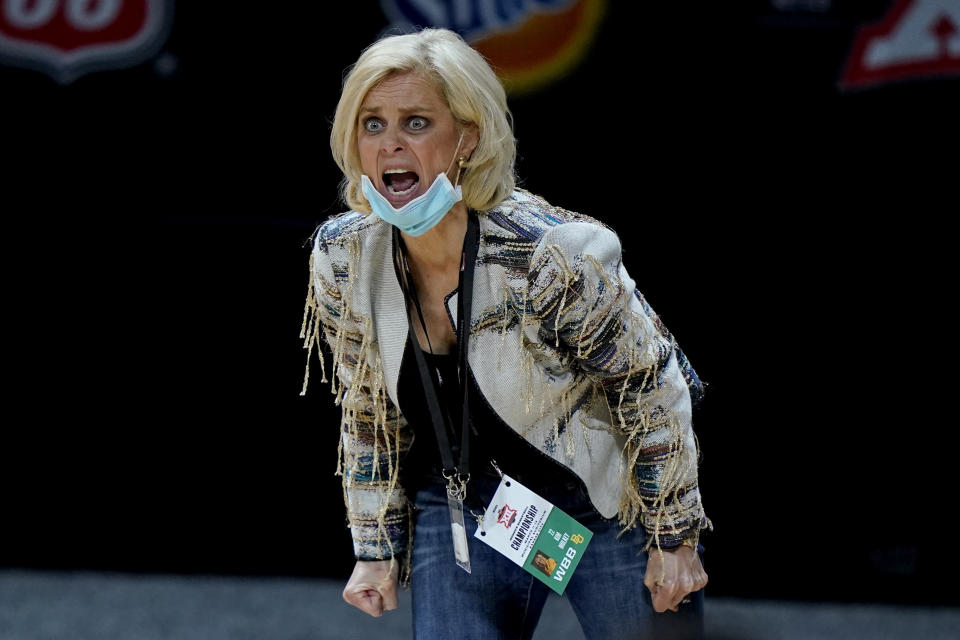 Baylor head coach Kim Mulkey talks to her players during the second half of an NCAA college basketball game against West Virginia in the final round of the Big 12 Conference tournament in Kansas City, Mo, Sunday, March 14, 2021. (AP Photo/Charlie Riedel)