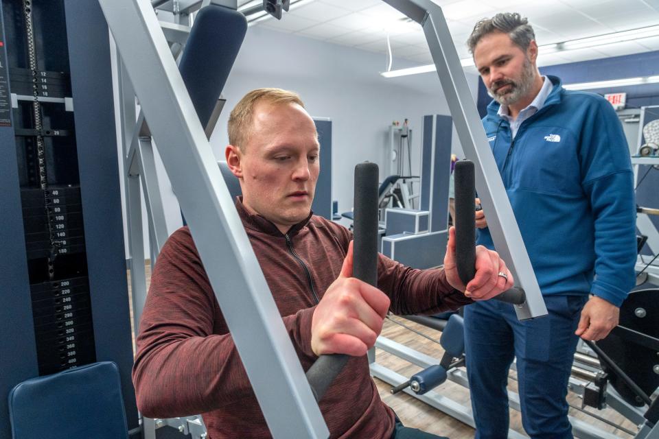 Sean Copeland, left, works out with Personal Fitness Coach Kyle Morrison at Exercise Inc., Wednesday, Jan. 10, 2024 in Greenwood, Indiana. The 20-minute workout circuit once a week works with Copeland’s use of the Eli Lilly drug Mounjaro to help with weight loss.