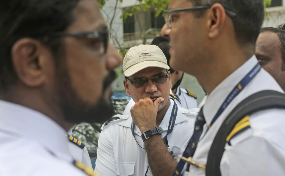 Employees of Jet Airways gather to demand clarification on unpaid salaries at Jet Airways headquarters in Mumbai, India, Monday, April 15, 2019. India's ailing Jet Airways has drastically reduced operations amid talks with investors to purchase a controlling stake in the airline and help it reduce its mounting debt. (AP Photo/Rafiq Maqbool)
