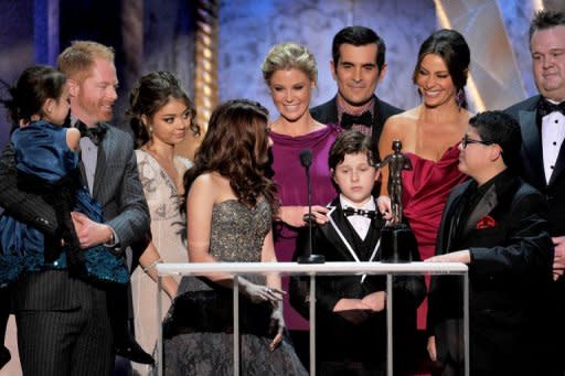 The cast of 'Modern Family' accept at a Screen Actors Guild Award in Los Angeles in January. Cult retro series "Mad Men" and comedy hit "Modern Family" are Emmys favorites again this weekend -- but a bunch of newcomers could yet produce surprises at US television's annual awards show