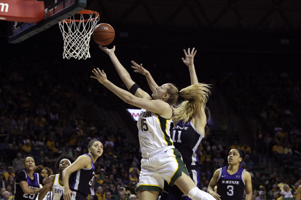 Baylor forward Lauren Cox, center left, scores past Kansas State forward Peyton Williams, center right, in the second half of an NCAA college basketball game, Saturday, Feb. 29, 2020, in Waco, Texas. (AP Photo/Rod Aydelotte)