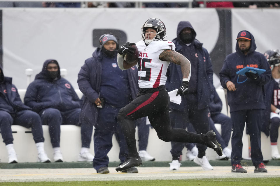 Atlanta Falcons running back Tyler Allgeier (25) runs in for a touchdown in the first half of an NFL football game against the Chicago Bears in Chicago, Sunday, Dec. 31, 2023. (AP Photo/Charles Rex Arbogast)