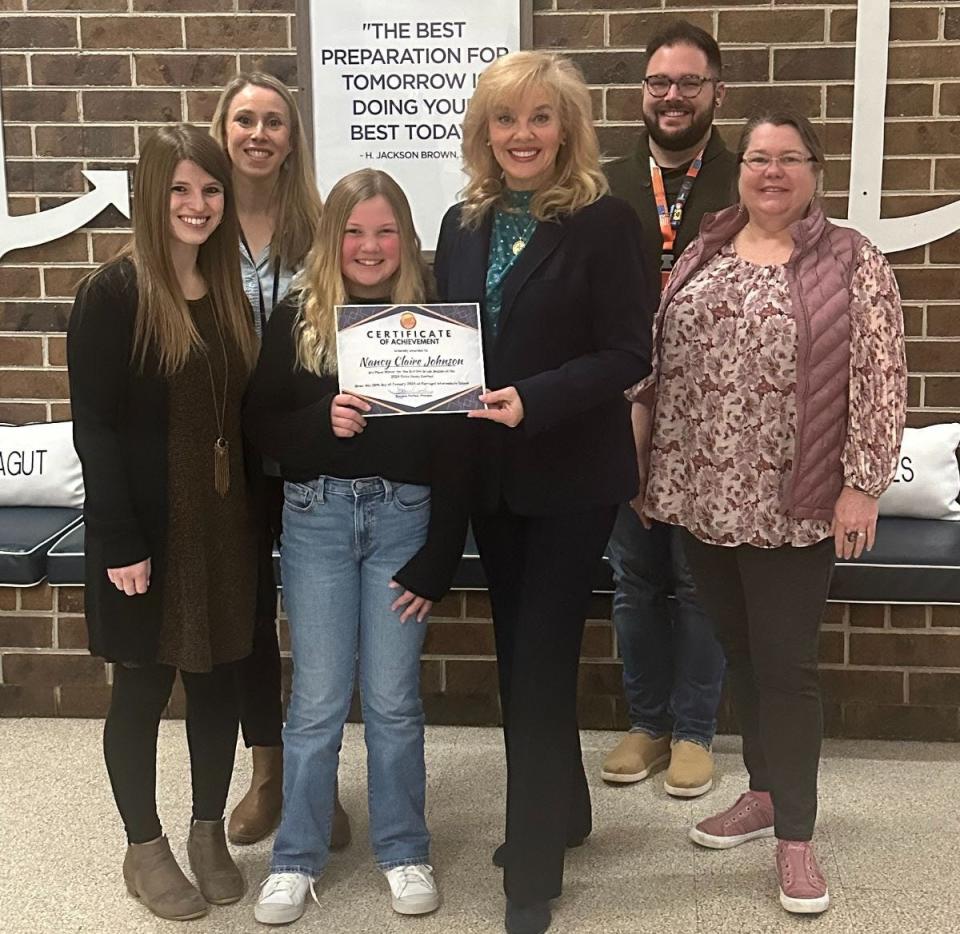 Farragut Intermediate School fifth grader Nancy Claire Johnson wins third place in the state for her civics essay in grades 3-5. From left: Haley Smith, science and social studies teacher; Katie Love-Pride, homeroom teacher; Nancy Claire; Suzanne Parham, FIS Principal; Cody Sipe, science and social studies teacher and civics essay co-chair; Dacia Maxwell-Hix, science and social studies teacher, civics essay co-chair and social studies department chair. January 2024.