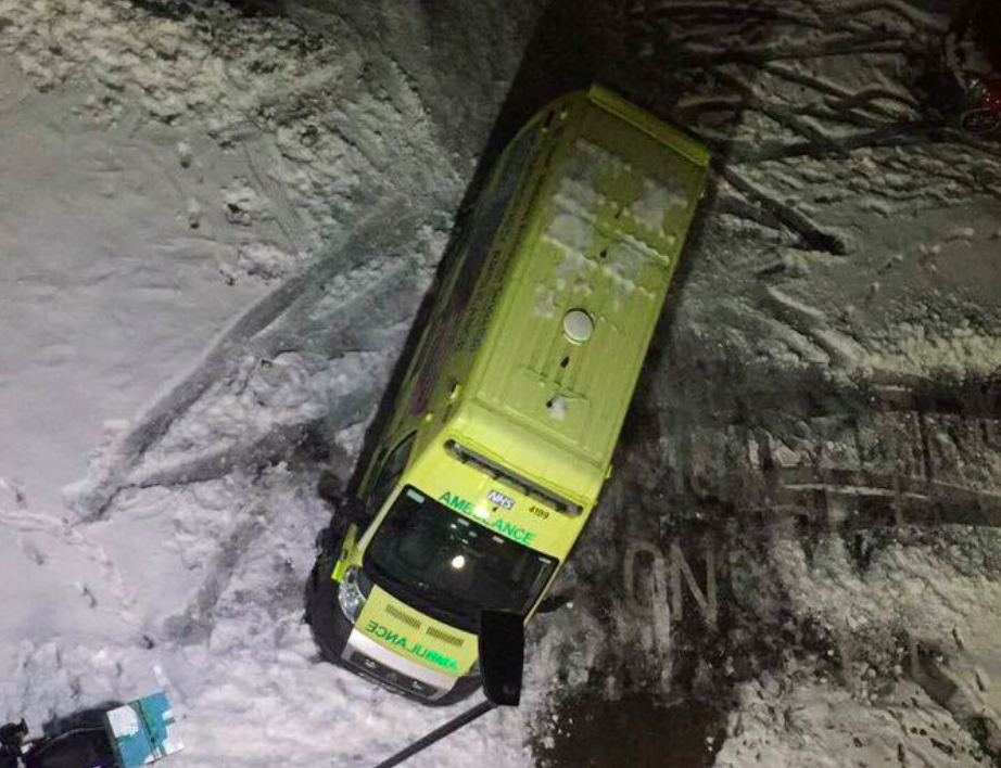 <em>The ambulance was stuck in the snow before neighbours helped dig it out (Twitter/B31 Voices)</em>