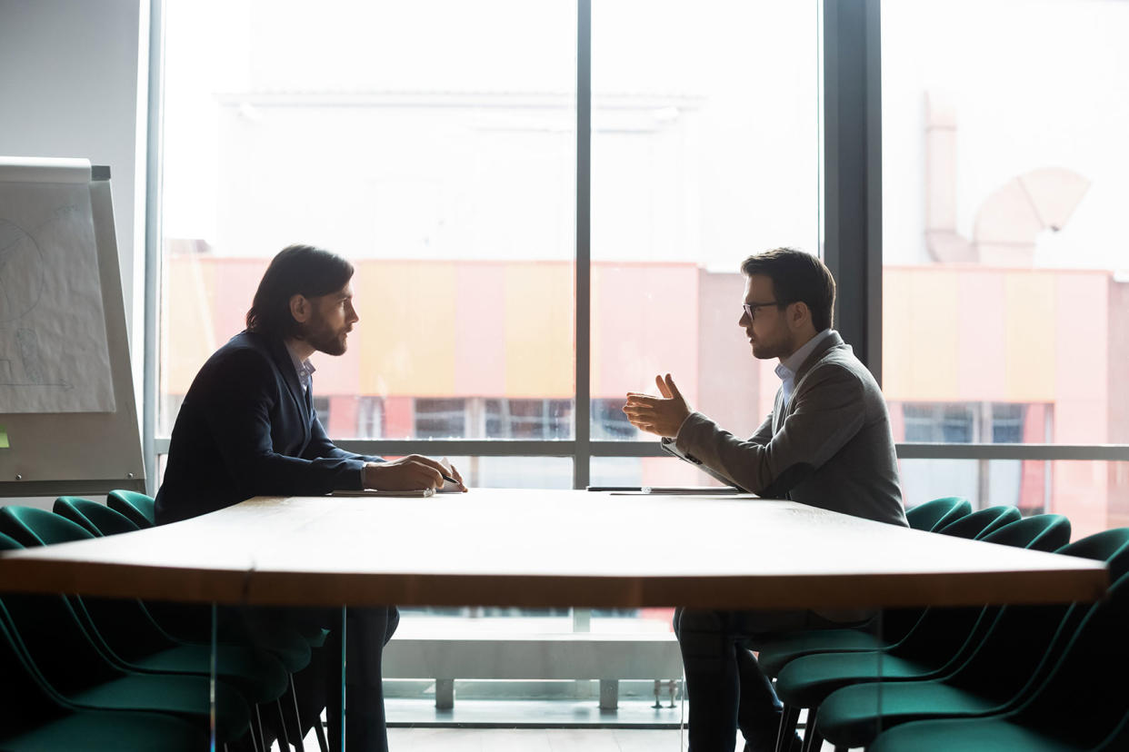 People in conversation meeting Getty Images/fizkes