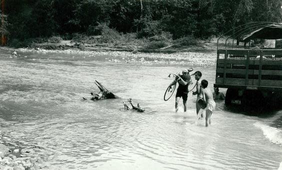 Efrain Forero fords a river during the Vuelta a Colombia (The Big Climb)