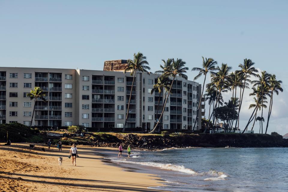 Beachgoers are seen at Kamaole Beach Park I in Kihei on the island of Maui, Hawaii Friday, Aug. 18, 2023.(Stephen Lam/San Francisco Chronicle via AP) ORG XMIT: CAFRA604