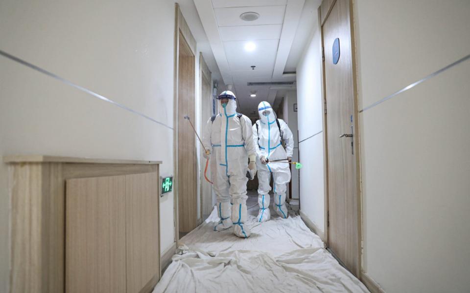 Staff disinfect a quarantine hotel on January 10, 2021 in Shenyang, Liaoning Province of China - Getty Images