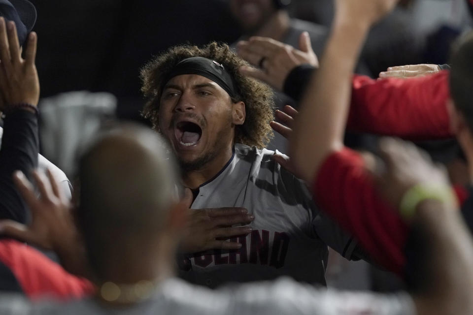 Cleveland Guardians' Josh Naylor celebrates his game tying grand slam off Chicago White Sox relief pitcher Liam Hendriks during the ninth inning of a baseball game Monday, May 9, 2022, in Chicago. (AP Photo/Charles Rex Arbogast)