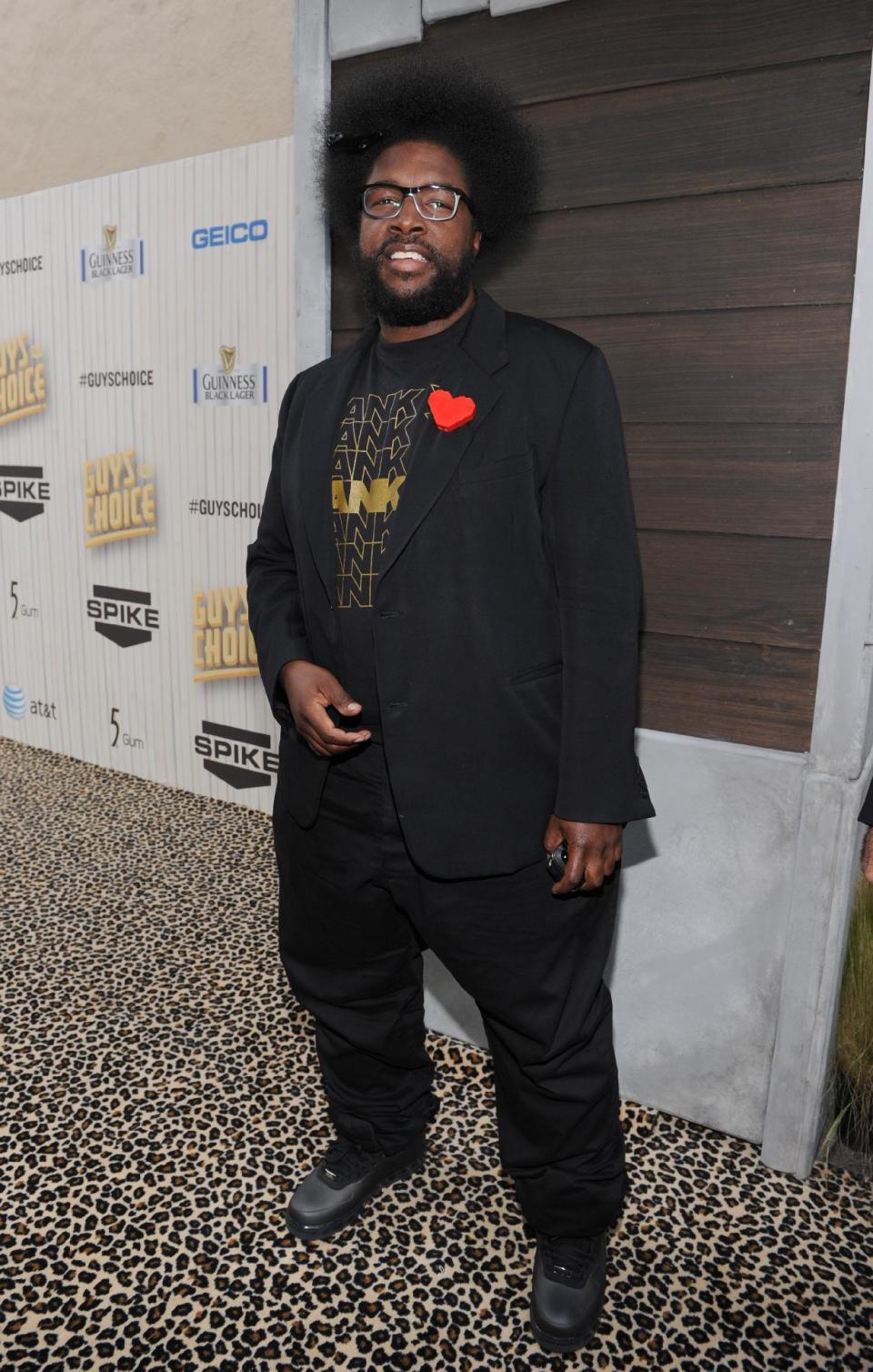 FILE - In this June 8, 2013 file photo, Questlove arrives at Spike TV's Guys Choice Awards at Sony Pictures Studios in Culver City, Calif. The Roots leader is executive producing a music series for VH1 that will feature three artists performing simultaneously on one stage. "SoundClash" debuts July 23, 2014, with Lil Wayne, Fall Out Boy and buzzed British group London Grammar. (Photo by Frank Micelotta/Invision/AP, File)