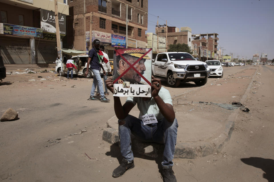 Sudanese demonstrators attend rally to demand the return to civilian rule nearly a year after a military coup led by General Abdel Fattah al-Burhan, in Khartoum, Sudan, Tuesday, Oct. 25, 2022. (AP Photo/Marwan Ali)