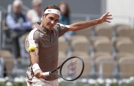 May 26, 2019; Paris, France; Roger Federer (SUI) hits the ball during his match against Lorenzo Song (not pictured) on day one of the 2019 French Open at Stade Roland Garros. Mandatory Credit: Susan Mullane-USA TODAY Sports