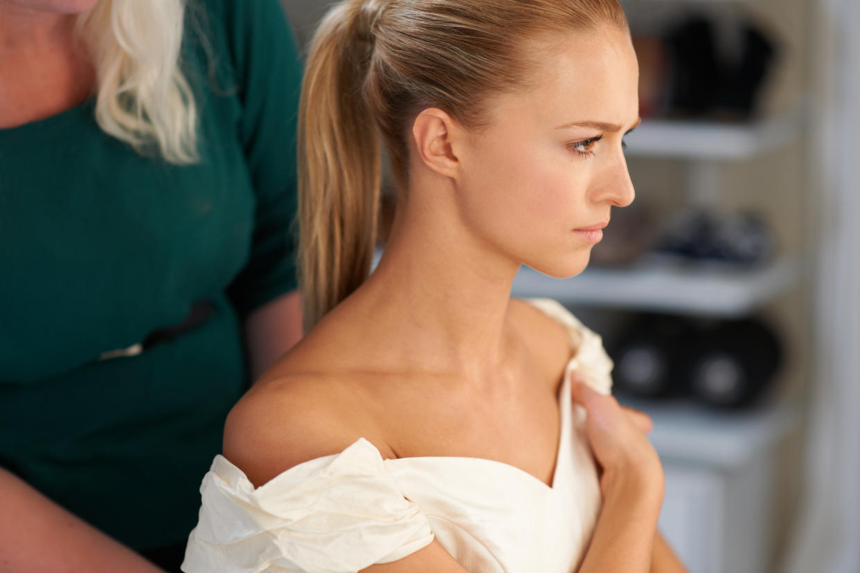 A young bride getting her hair done before the wedding