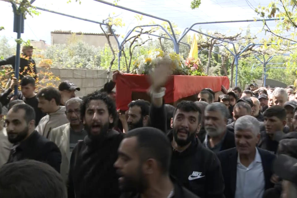 In this grab taken from video, mourners carry the coffin of Lebanese money changer Mohammad Srour, 57, who was found tortured and killed inside a villa in Monte Verdi neighborhood of Beit Meri, during his funeral procession in Labweh village, near the border with Syria, northeast Lebanon, Thursday, April 11, 2024. Lebanon’s interior minister alleged Wednesday that the mysterious abduction and killing of a Hezbollah-linked Lebanese financier in a villa on the edge of a quiet mountain resort town earlier this month was likely the work of Israeli operatives. (AP Photo)