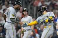 Milwaukee Brewers' William Contreras, right, celebrates his three-run home run against the Houston Astros with Jackson Chourio during the fifth inning of a baseball game Saturday, May 18, 2024, in Houston. (AP Photo/Eric Christian Smith)