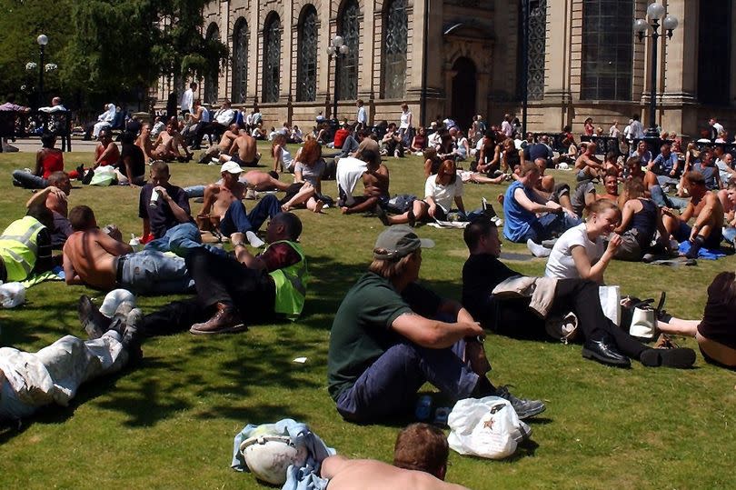 Brummies bask under St. Philip's Cathedral during the 2006 heatwave.