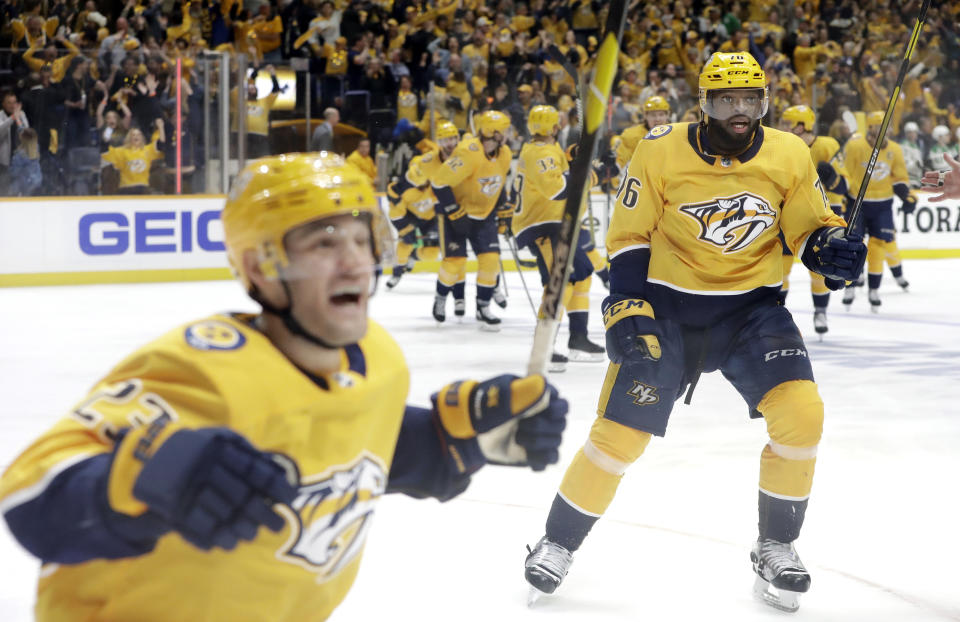 Nashville Predators defenseman P.K. Subban (76) and center Rocco Grimaldi (23) skate across the ice to celebrate after defeating the Dallas Stars in overtime of Game 2 in an NHL hockey first-round playoff series Saturday, April 13, 2019, in Nashville, Tenn. (AP Photo/Mark Humphrey)