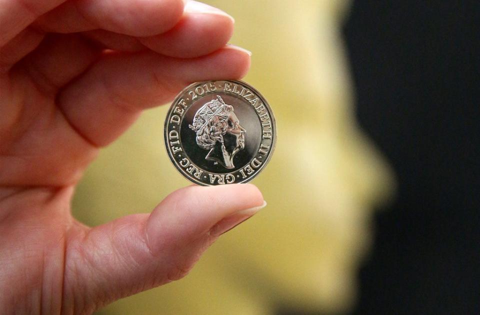 A two pound coin featuring a new portrait of Queen Elizabeth II is displayed at The National Portrait Gallery on March 2, 2015 (Getty Images)