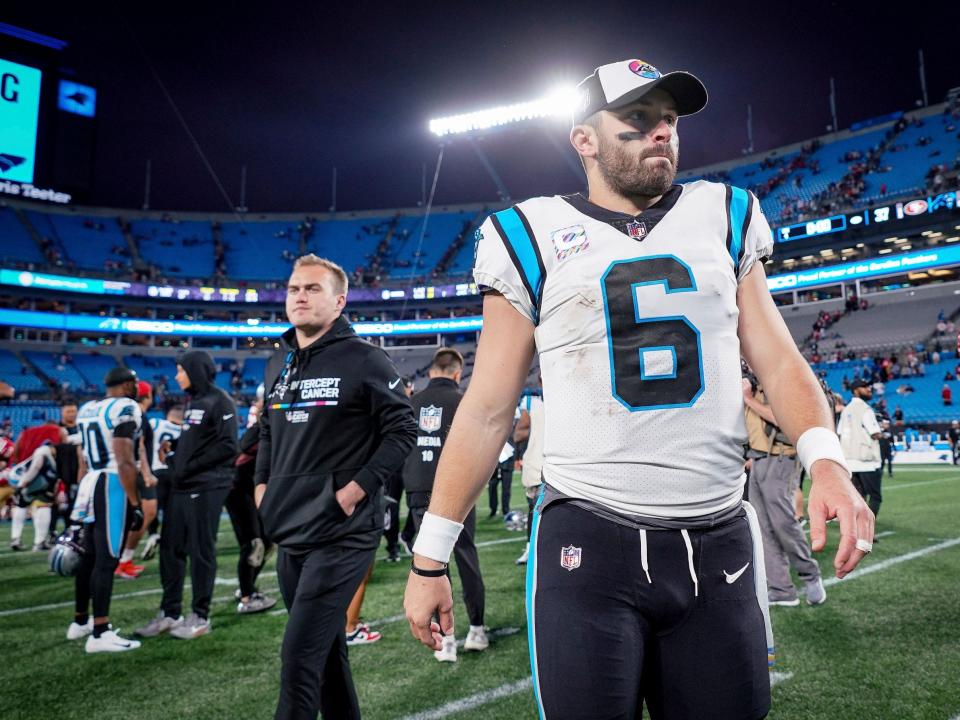 Baker Mayfield walks off the field after a loss to the San Francisco 49ers.