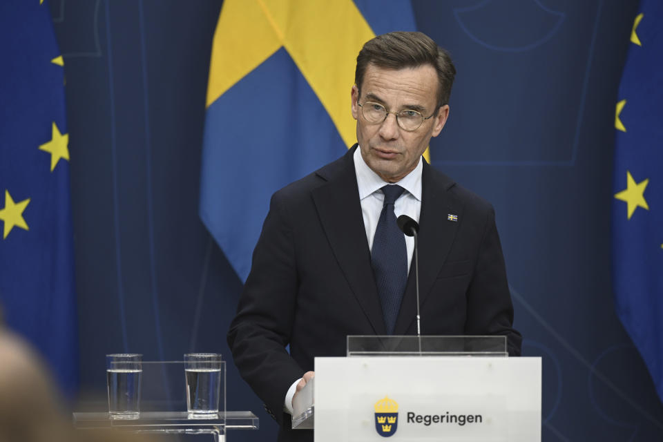 Swedish Prime Minister Ulf Kristersson makes a statement on the shooting of two Swedish soccer fans in Brussels on Monday, at Rosenbad, Stockholm, Tuesday, Oct. 17, 2023. Belgian police on Tuesday shot dead a suspected Tunisian extremist accused of killing two Swedish soccer fans in a brazen shooting on a Brussels street before disappearing into the night. (Fredrik Sandberg/TT News Agency via AP)