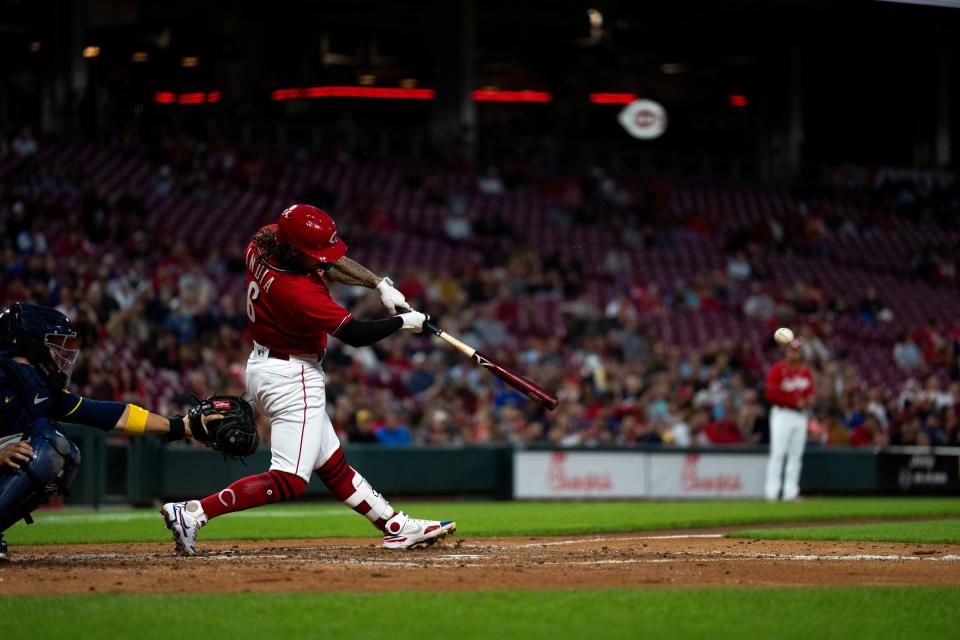 Cincinnati Reds second baseman Jonathan India picks up a hit. After a down year in 2022, India has made big changes to his approach and his leadership style to get the Reds more competitive.