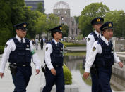 <p>With a backdrop of the gutted Atomic Bomb Dome, police officers patrol at the Hiroshima Peace Memorial Park in Hiroshima, southwestern Japan, Thursday, May 26, 2016. U.S. President Barack Obama is to visit Hiroshima on Friday, May 27 after the Group of Seven summit in central Japan, becoming the first serving American president to do so. (Photo: Shuji Kajiyama/AP) </p>