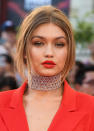 <p>According to Maybelline makeup artist Patrick Ta, who did Gigi’s makeup for the show, the 21-year-old wanted “a bronze and beautiful eye with a bold aspect to it, which was the red lip.” Mission accomplished! <i>(Photo by George Pimentel/WireImage)</i></p>